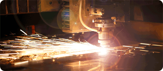 A plasma table cutting metal with bright sparks
